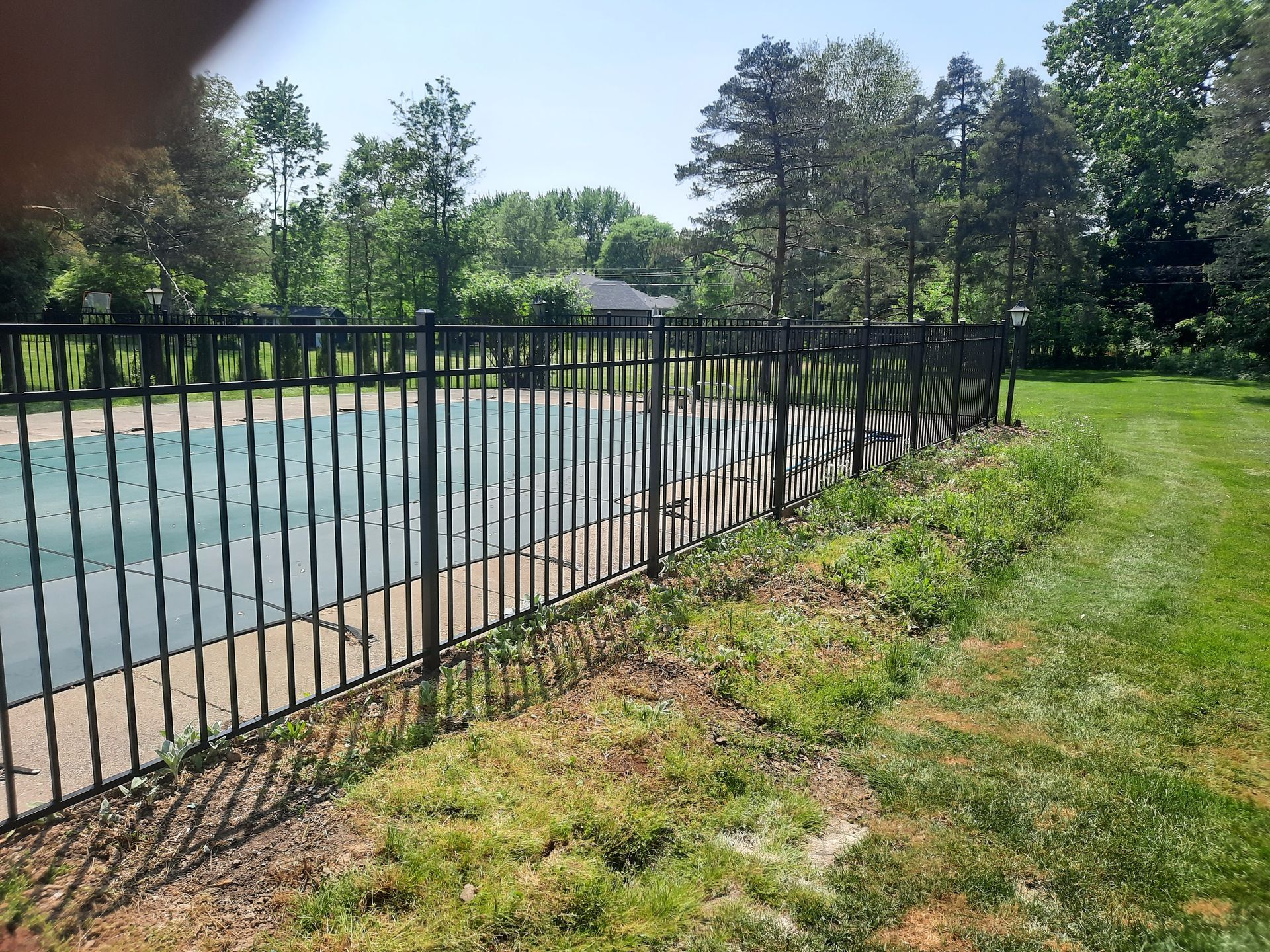 Wrought iron and aluminum fence installation in Delavan, NY by KKR Fencing
