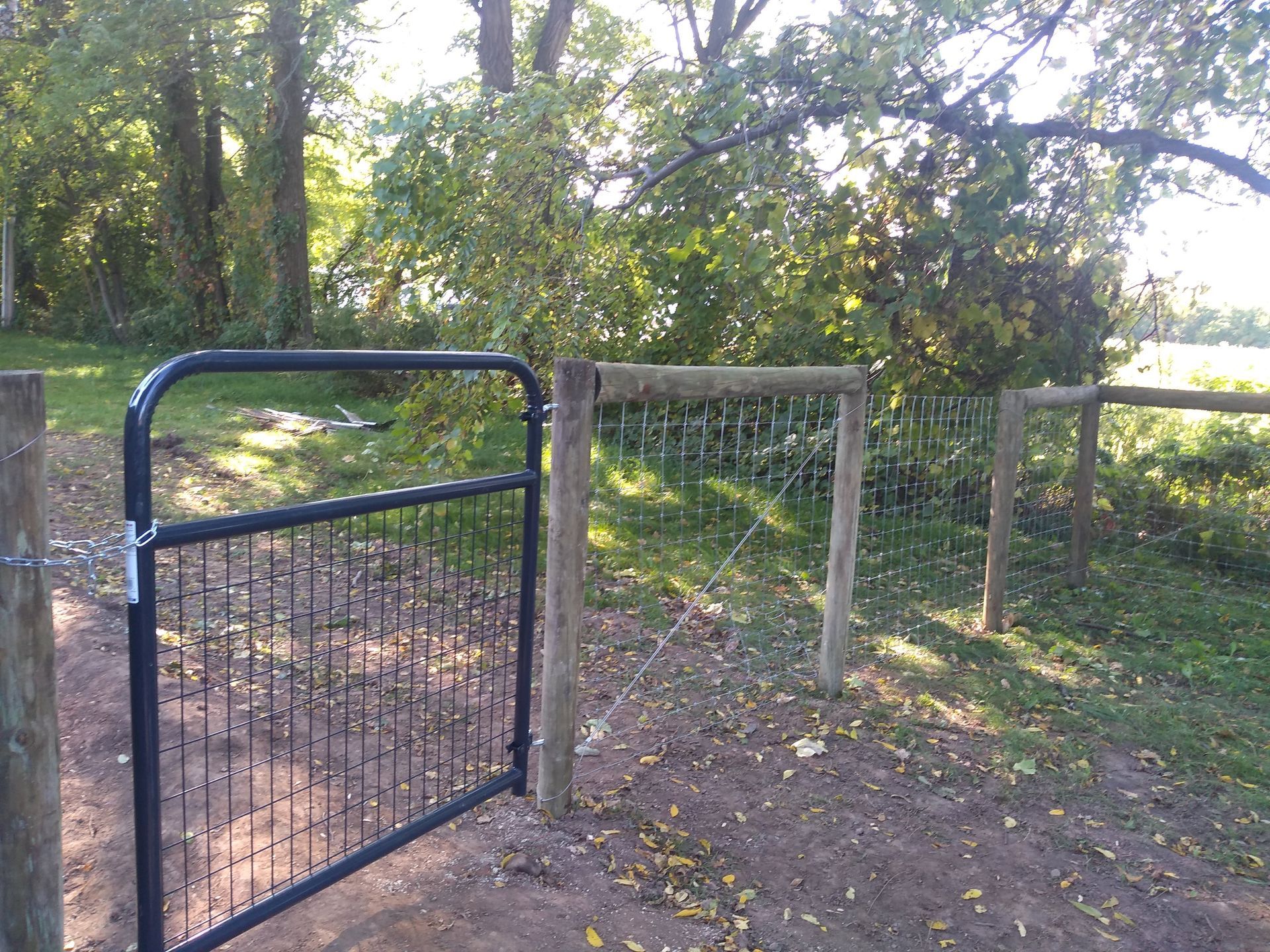 Chain link fence installation in Delavan, NY by KKR Fencing