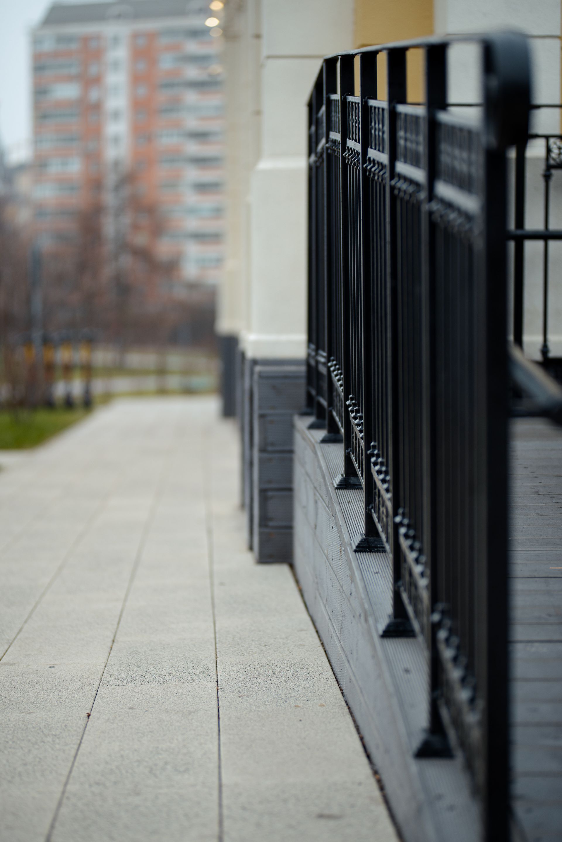 metal fence on the side of commercial building