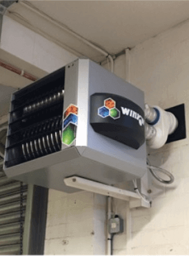 a wing heater is mounted to the side of a building