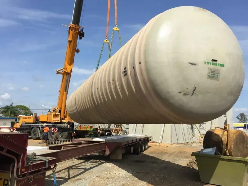 A Large Tank Is Being Lifted by A Crane on A Trailer — North Coast Cranes In Coffs Harbour, NSW