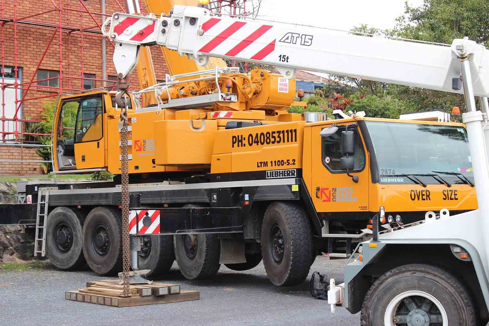 A Yellow And White Truck With A Crane On Top Of It  — North Coast Cranes In Macksville, NSW