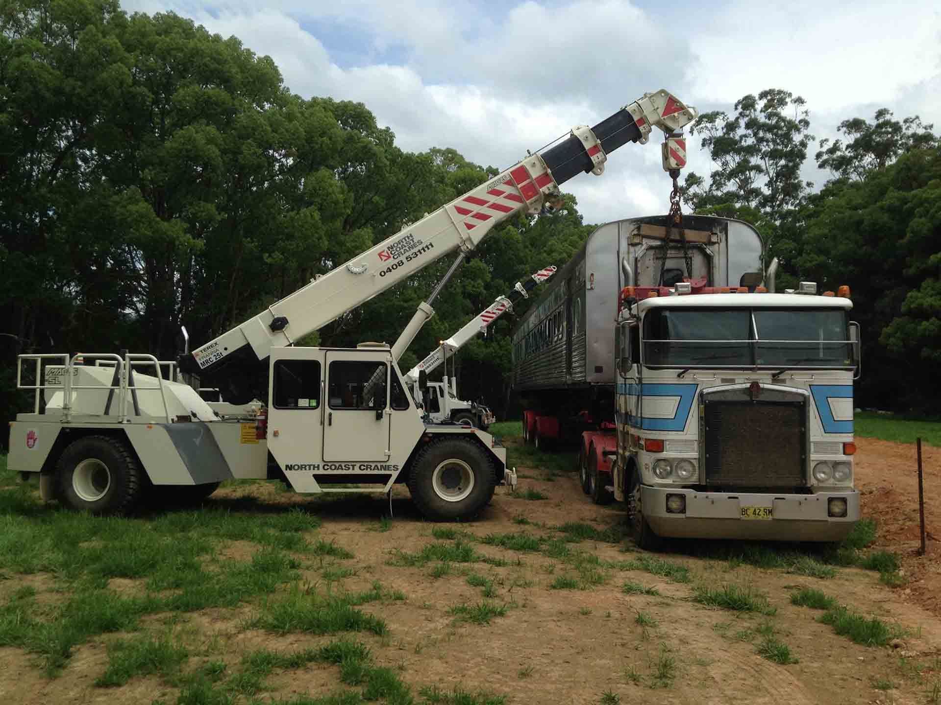 A White Truck With A Crane Attached To It — North Coast Cranes In Armidale, NSW