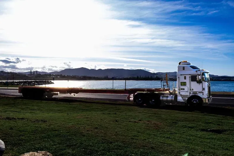 A Large White Truck Is Parked on The Side of The Road — North Coast Cranes In Coffs Harbour, NSW