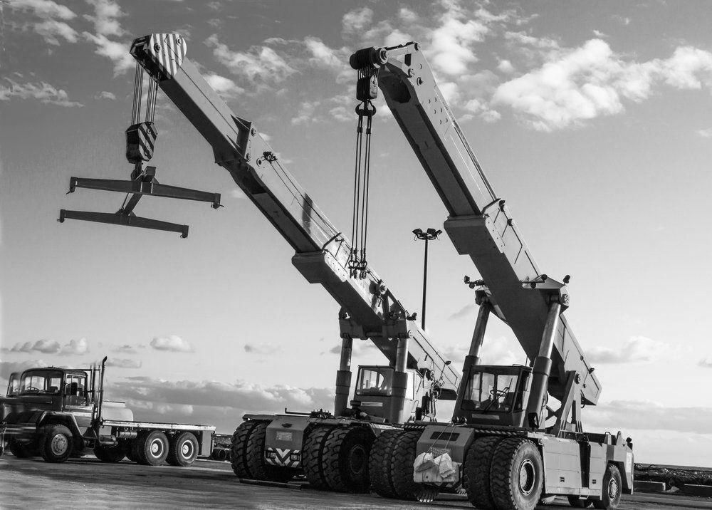 A Black And White Photo Of A Crane In A Parking Lot — North Coast Cranes In Coffs Harbour, NSW