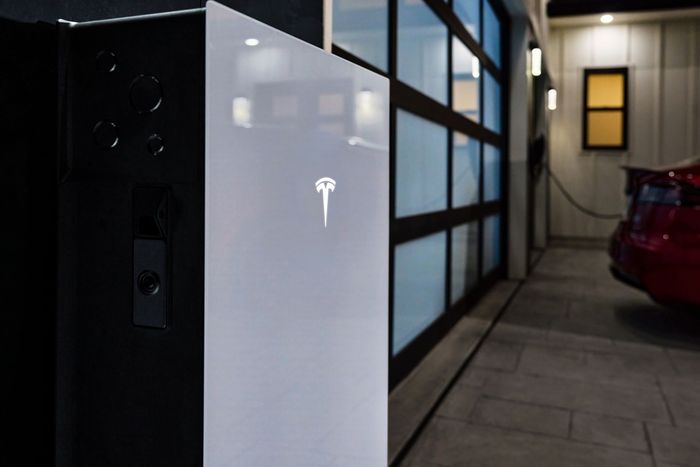 Tesla Powerwall 3 battery storage system mounted in a residential garage