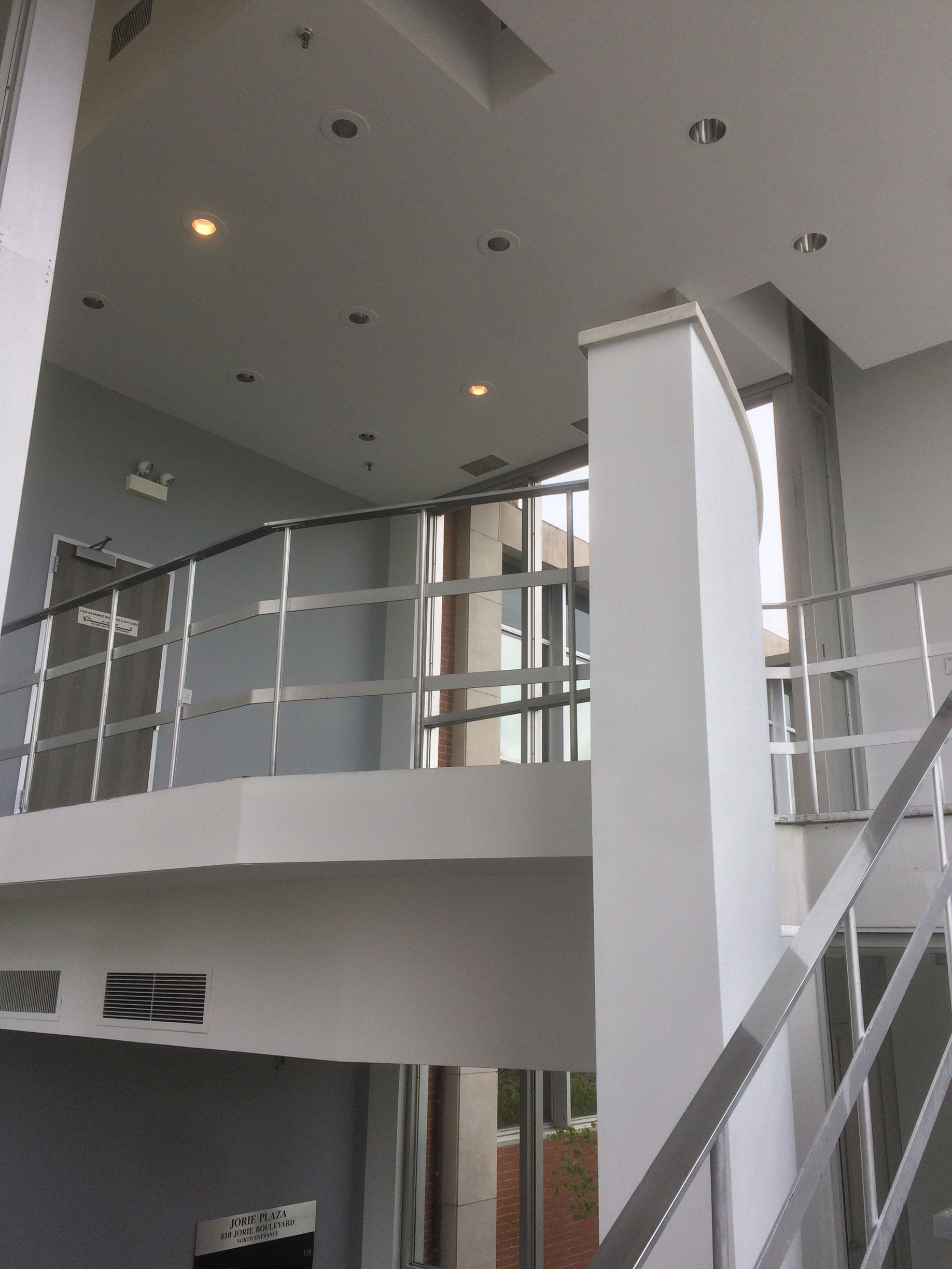 Kitchen with hardwood floors, a large island, and glass doors leading outside.