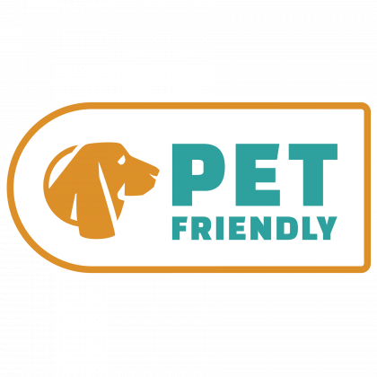 A logo for pet friendly with a dog on it.