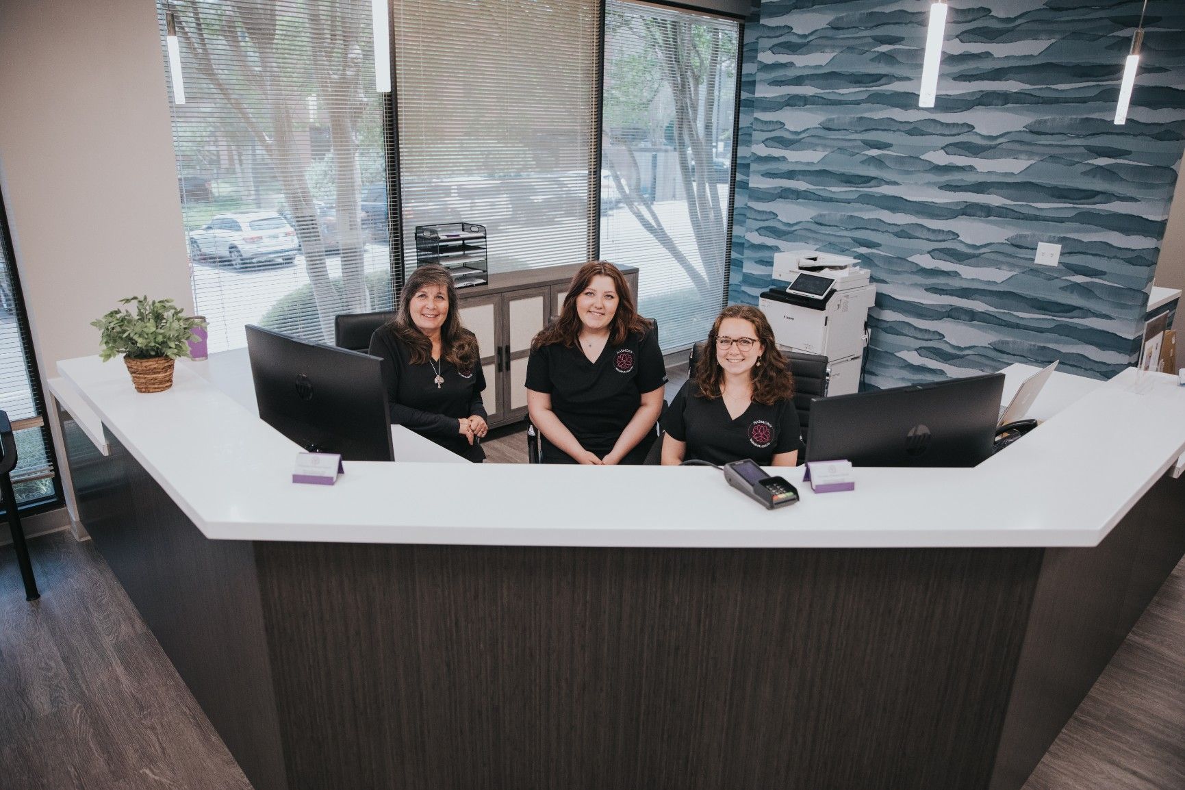 group photo of three women, Harmony Women's front desk staff