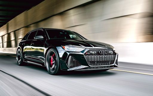 Black Audi RS6 wrapped in Llumar Platinum PPF driving in tunnel.