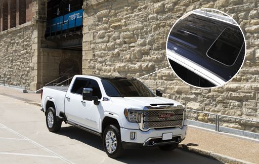 Gloss black roof wrap on GMC Sierra using Llumar Select Black PPF.