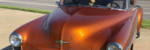 Vehicle hood protected with self-healing LLumar paint protection film.