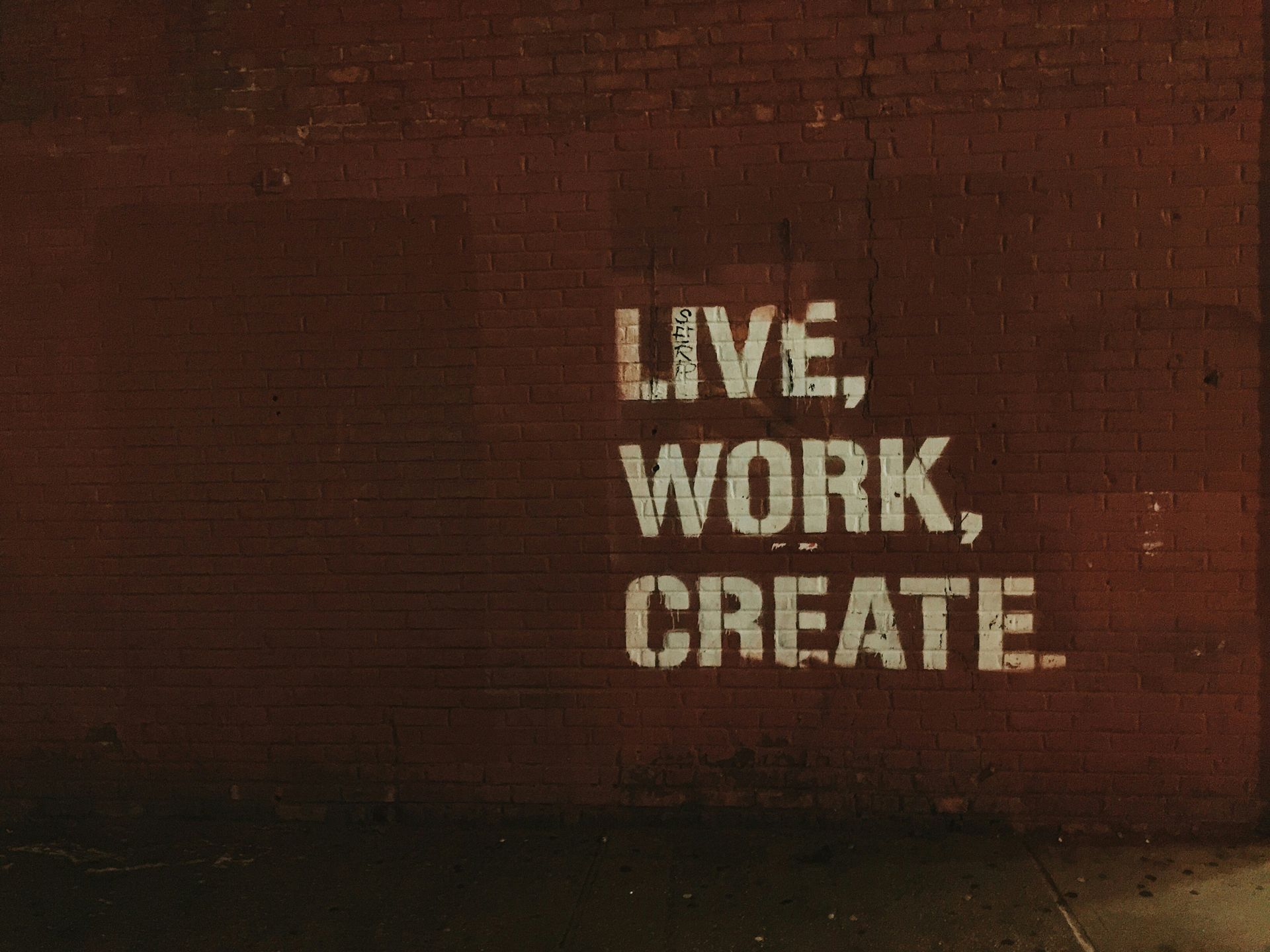 The words live, work, and create are listed on a brown background