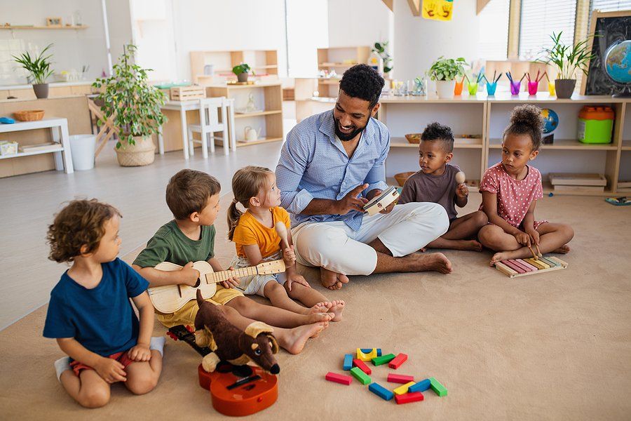 man teaching the kids how to use the instruments