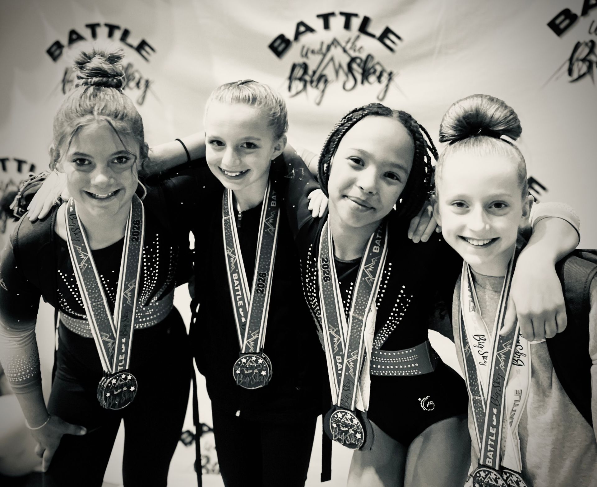 A young girl is doing a handstand on a blue carpet