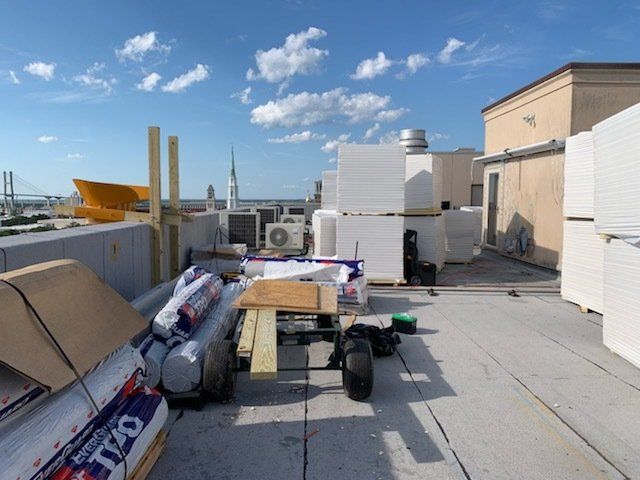 A rooftop with a cart full of styrofoam on it
