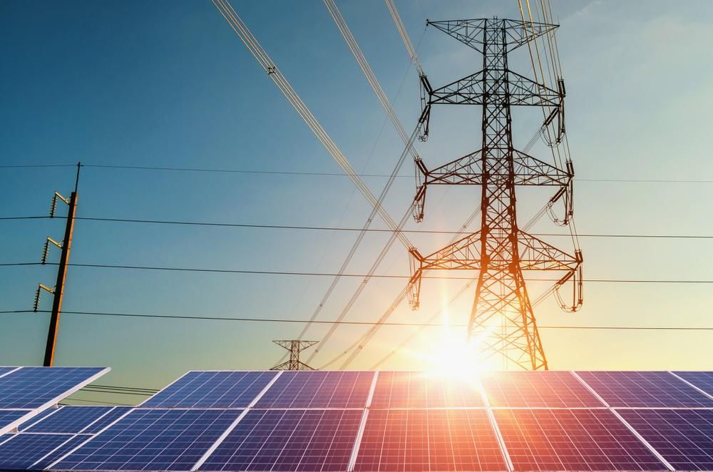 There Are Solar Panels And Power Lines In The Background — Mission Solar And Electrical In Innisfail, QLD