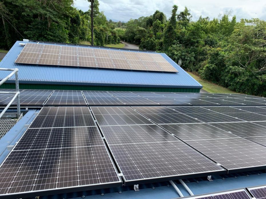 Solar Panels Installed on Blue Metal Roof — Mission Solar And Electrical In Mission Beach, QLD