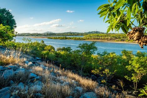 A River Surrounded By Trees And Rocks On A Sunny Day — Mission Solar And Electrical In Cardwell, QLD