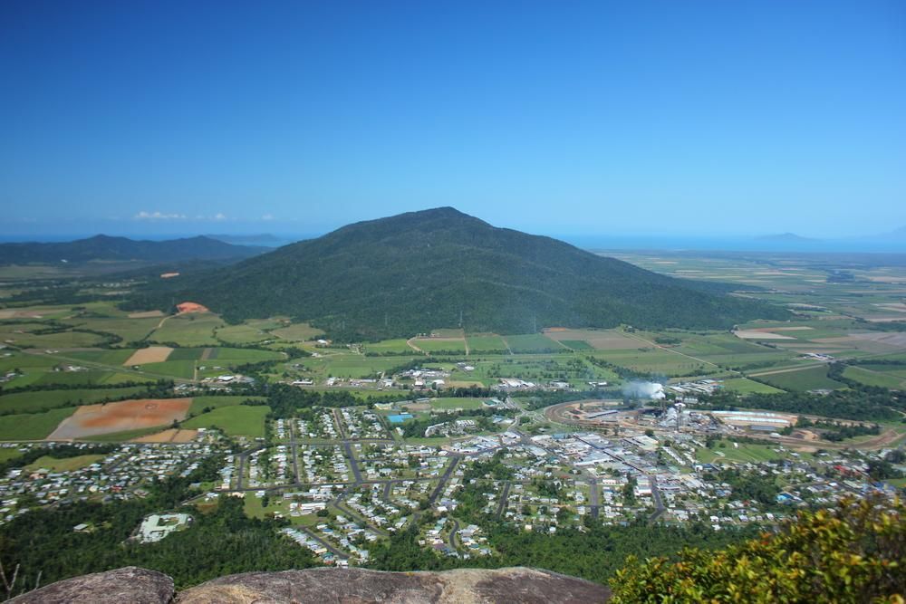 A View Of A City And A Mountain From The Top Of A Mountain  — Mission Solar And Electrical In Tully, QLD