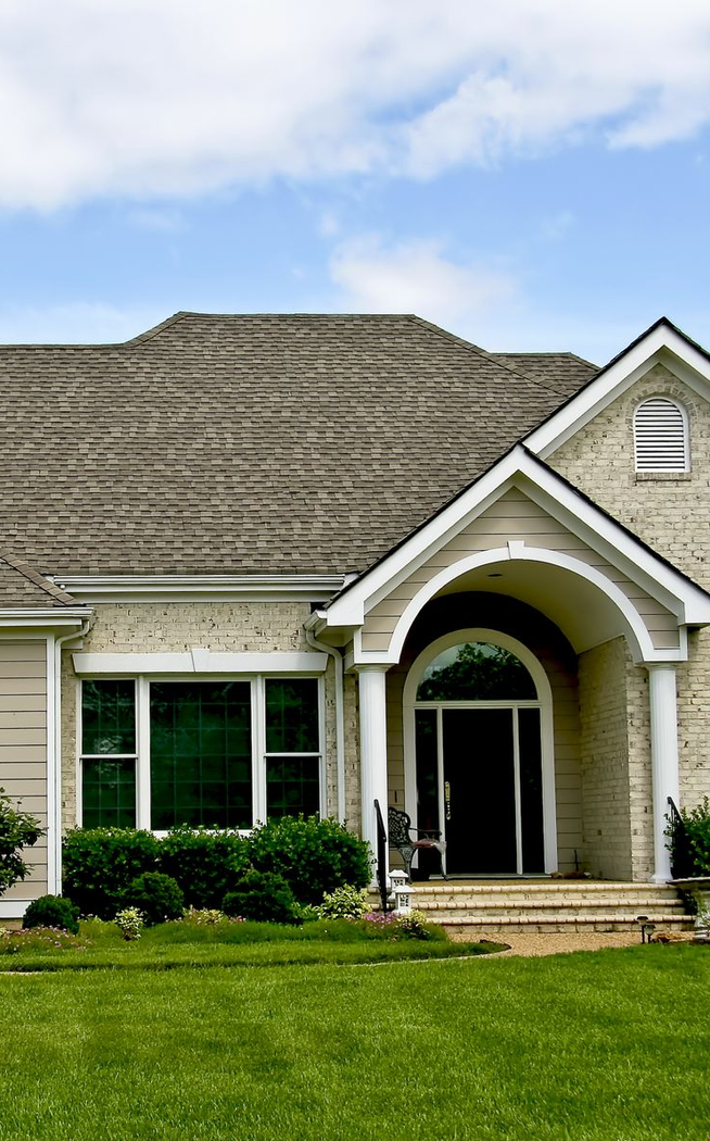 Long hallway with a window reflecting a street, sunlight. Building architecture, blue and gray tones.