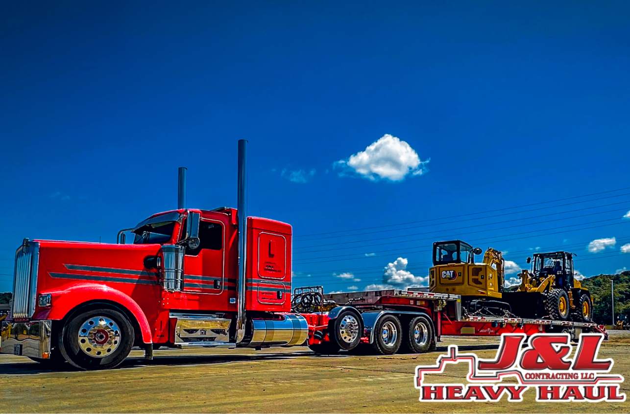 A truck is carrying an oversized load on a trailer.
