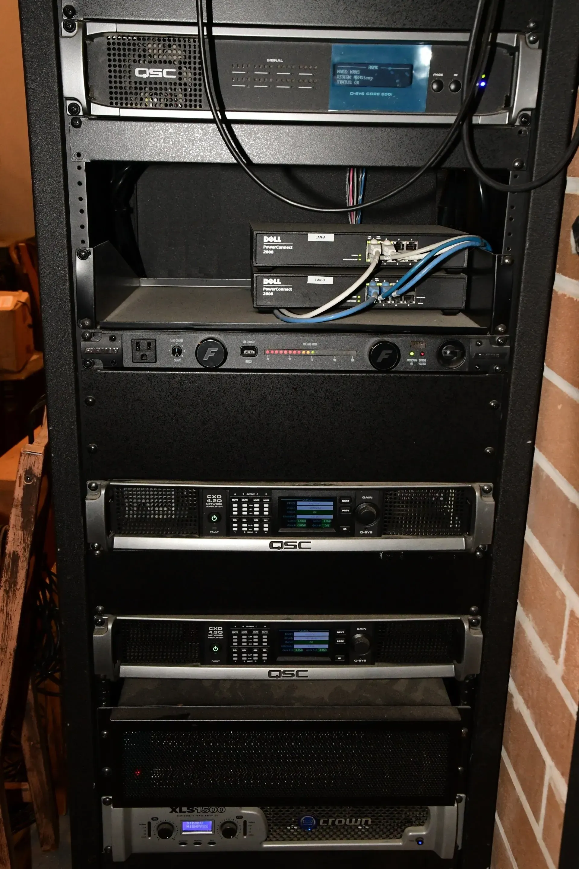 A rack with a bunch of electronic equipment on it