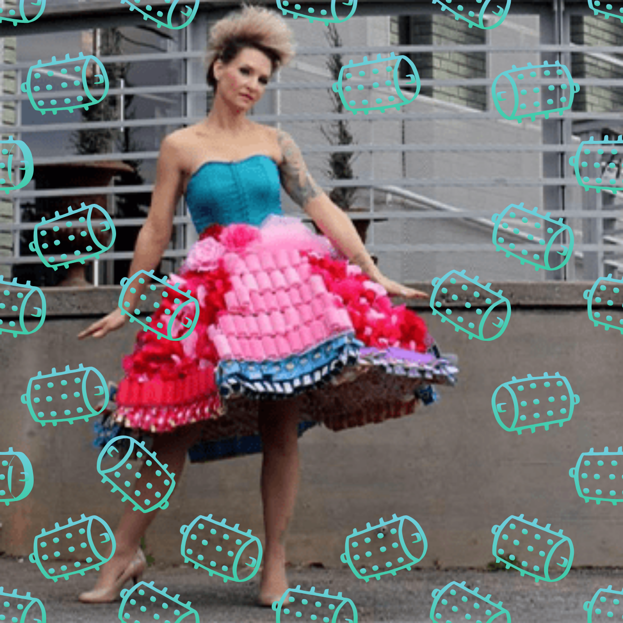 A woman in a pink and blue dress is surrounded by spikes