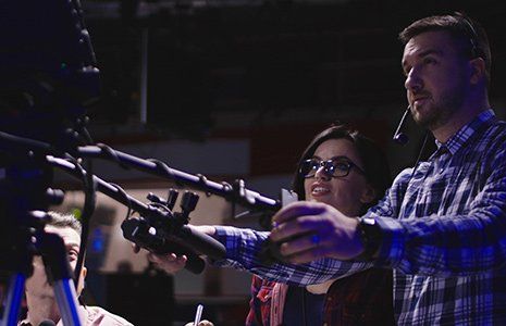 Multimedia — Cameraman Shooting in a Presentation in Albuquerque, NM Multimedia — Cameraman Shooting in a Presentation in Albuquerque, NM