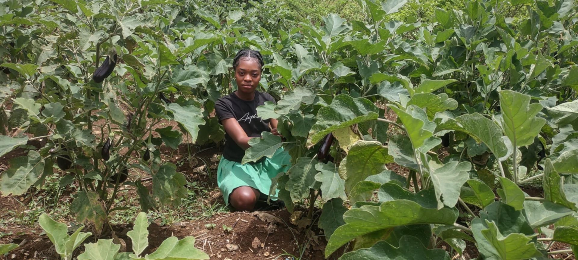 A picture of one young woman in her garden.