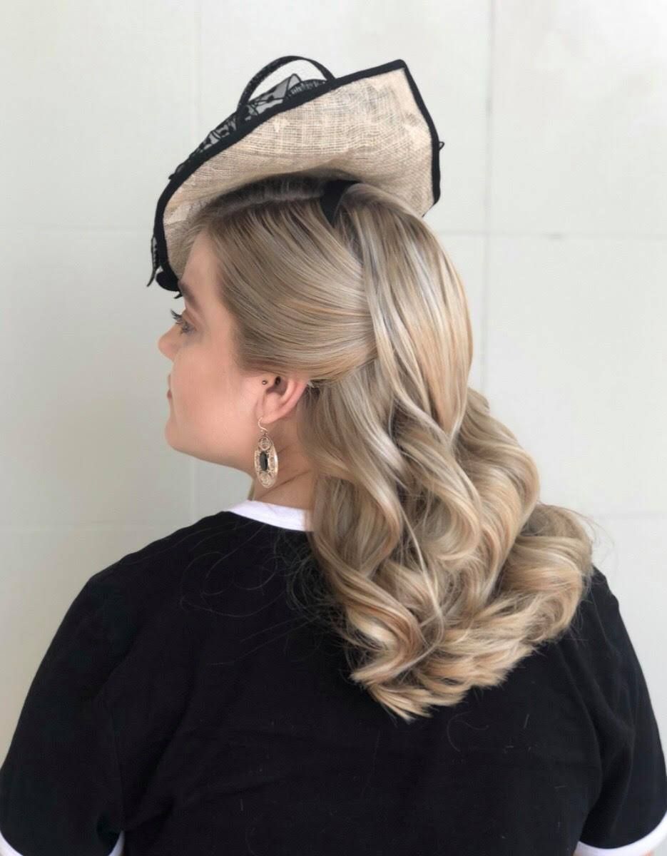 A Woman With Long Blonde Hair Is Wearing A Half Up Half Down Hairstyle — Carlee Hair Design In Anula, NT