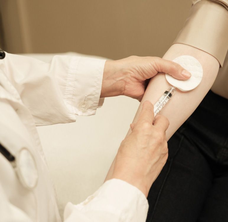 A woman is getting a facial treatment at a beauty salon.