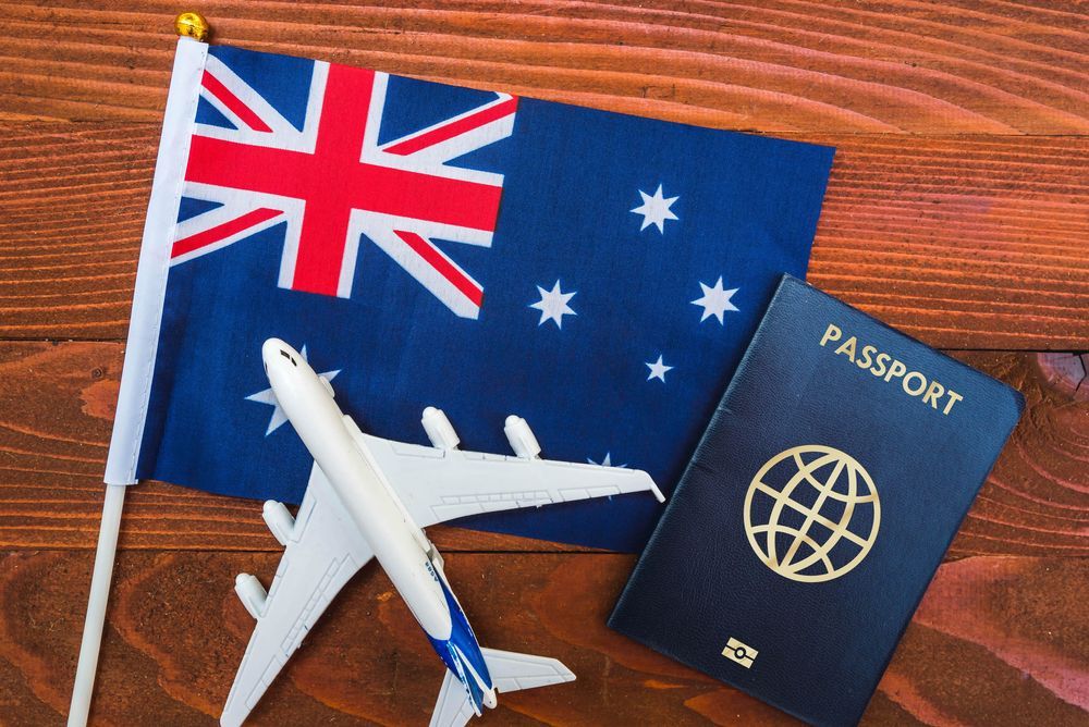 Australia Flag with passport and airplane