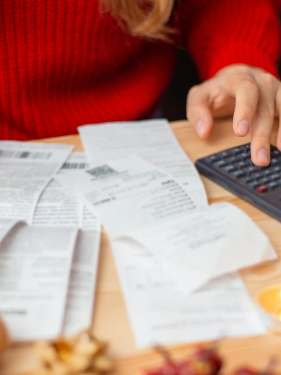 Several hands with pens