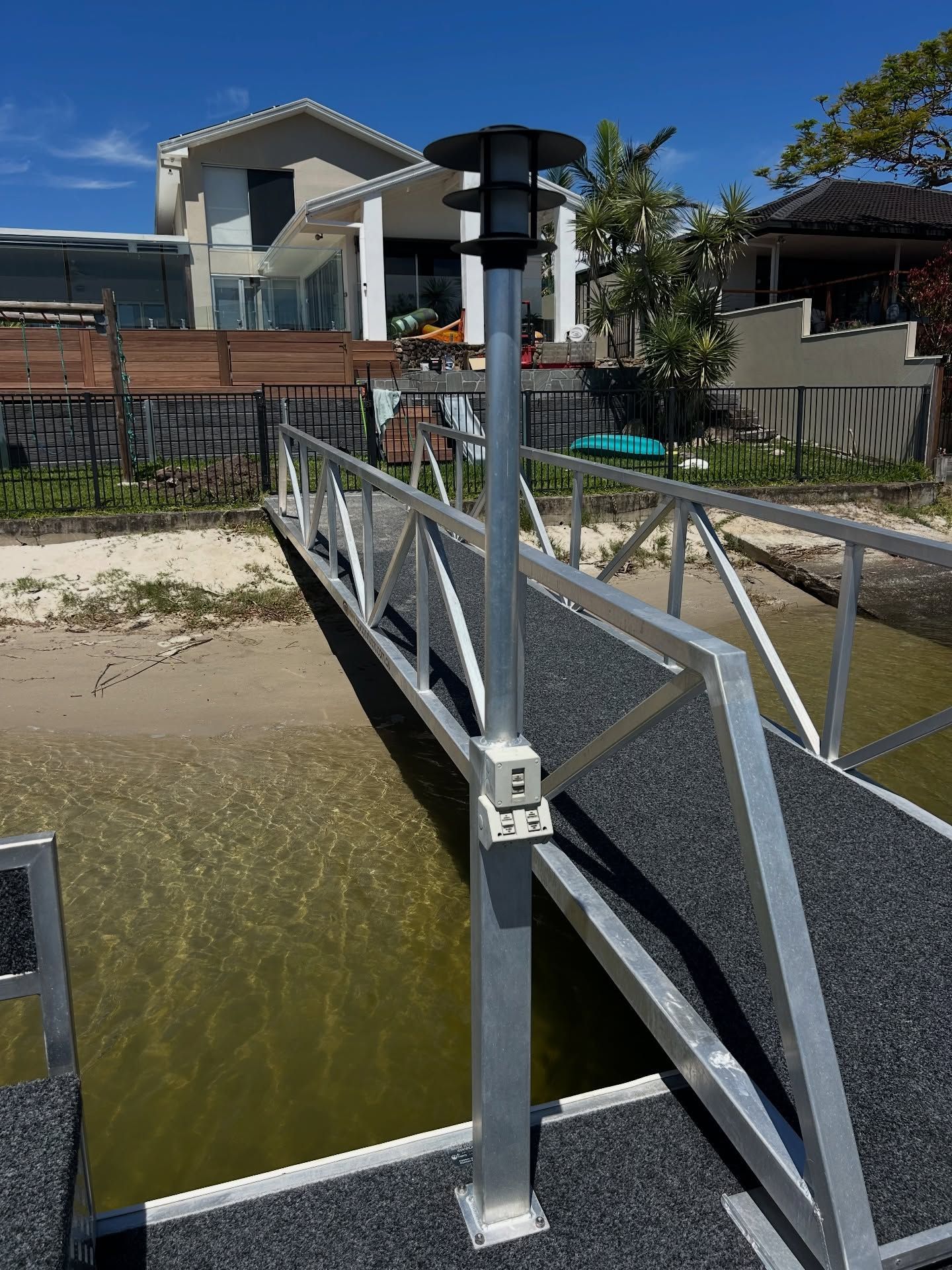 A Metal Walkway With a Dark, Textured Surface — BTM Electrical & Air in Burleigh Waters, QLD