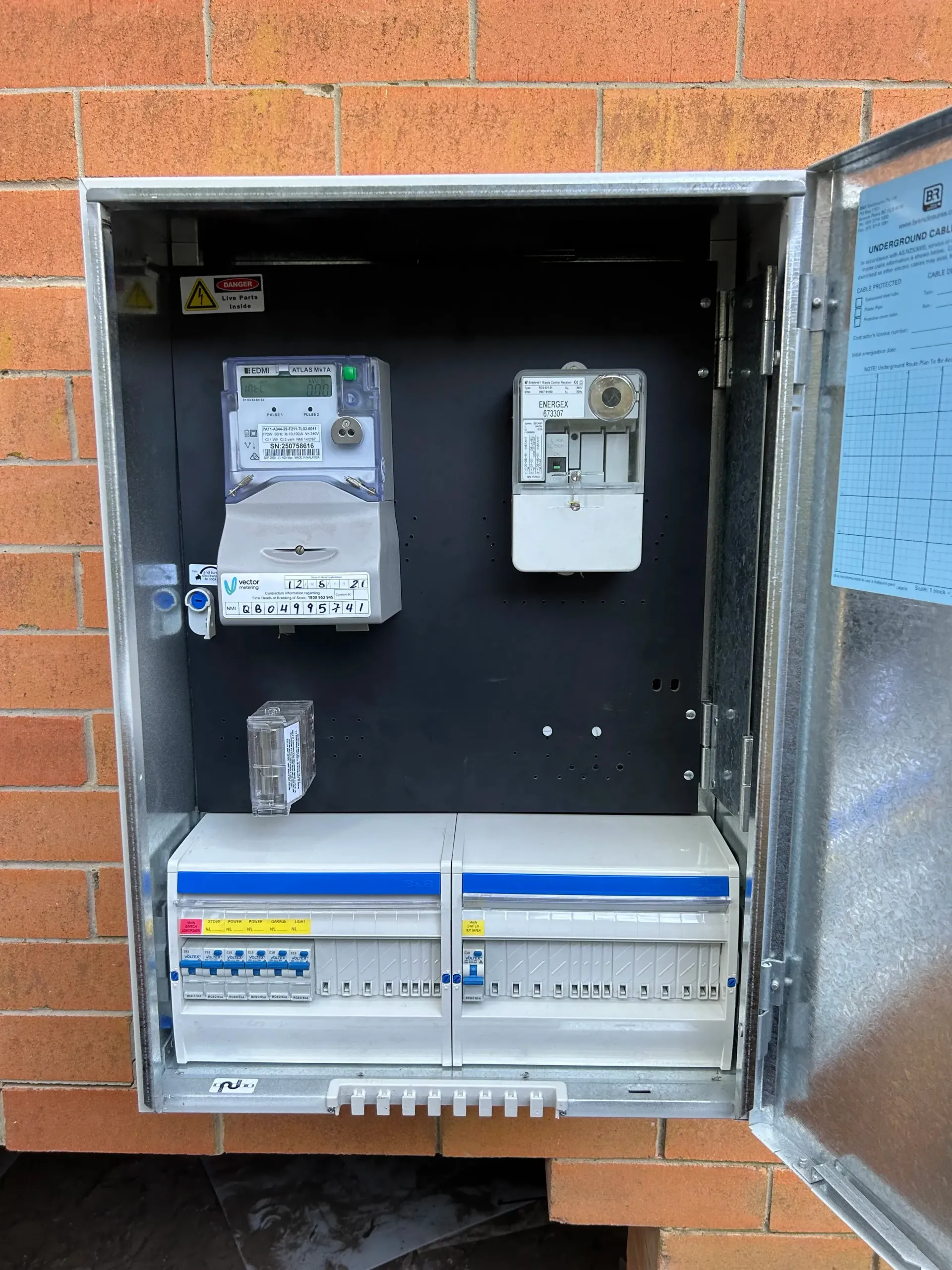 An Open Metal Outdoor Electrical Meter Box — BTM Electrical & Air in Palm Beach, QLD