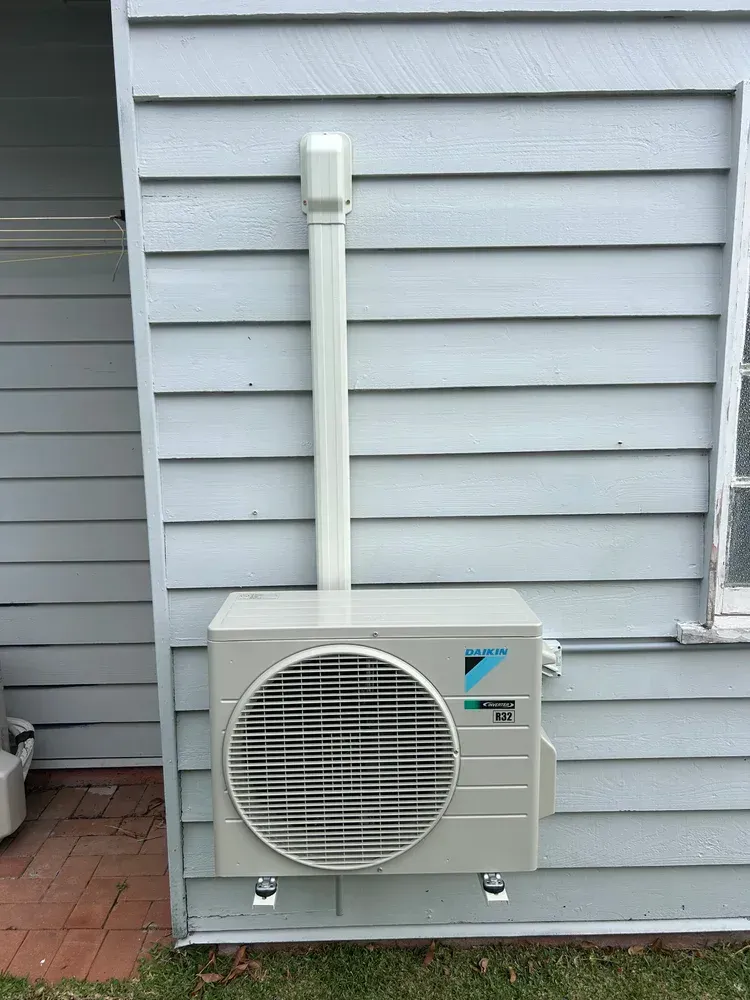A Beige Daikin Outdoor Air Conditioning Unit  — BTM Electrical & Air in Coolangatta, QLD