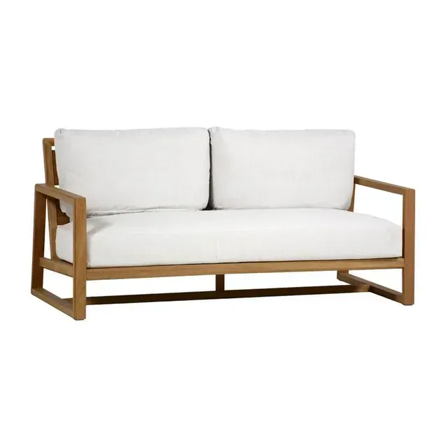 Wooden outdoor loveseat with white cushions.