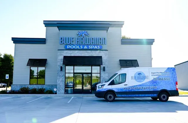 Blue Hawaiian Pools & Spas store with branded van parked out front.