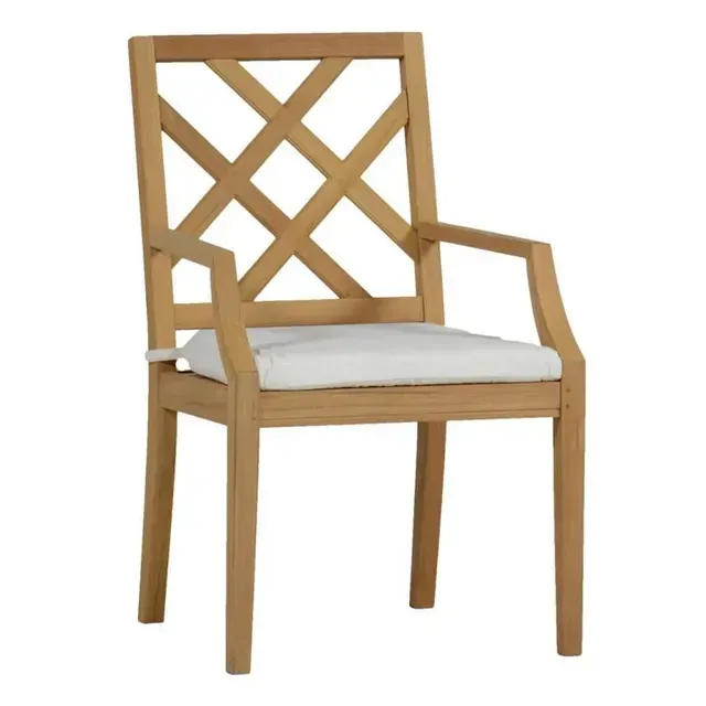 Wooden outdoor chair with white cushion and crisscross back.