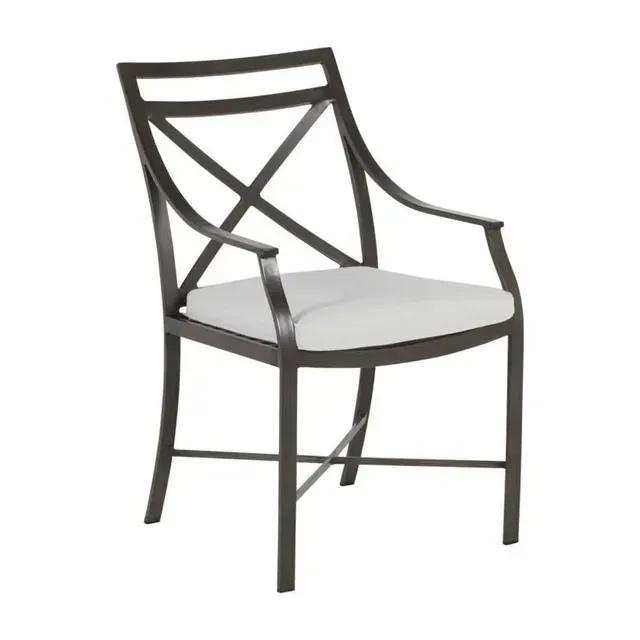 Dark metal outdoor armchair with white cushion and an X-shaped back.