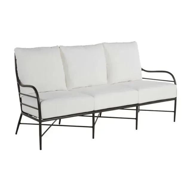 Black metal framed outdoor sofa with white cushions.