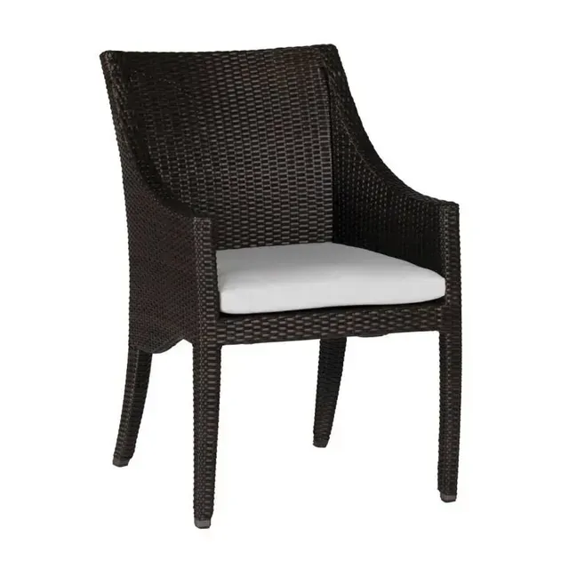 Brown wicker armchair with a white cushion.
