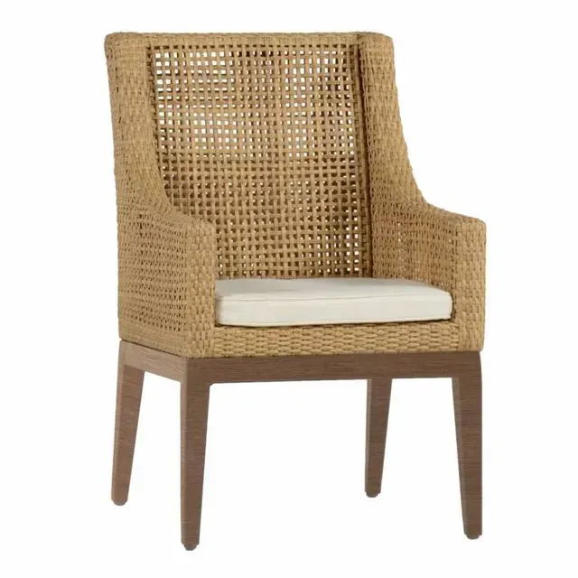 Woven wicker arm chair with tan cushion and wooden legs.