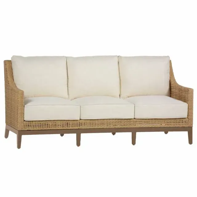 Wicker outdoor sofa with cream cushions.