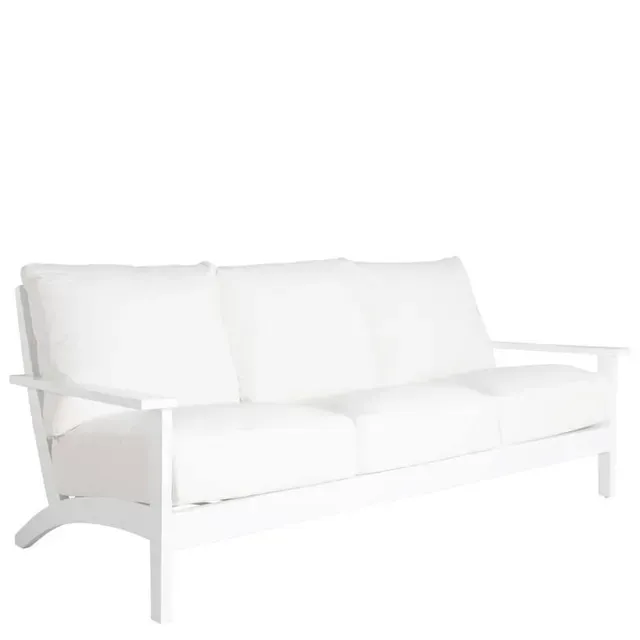 White outdoor sofa with three cushions.