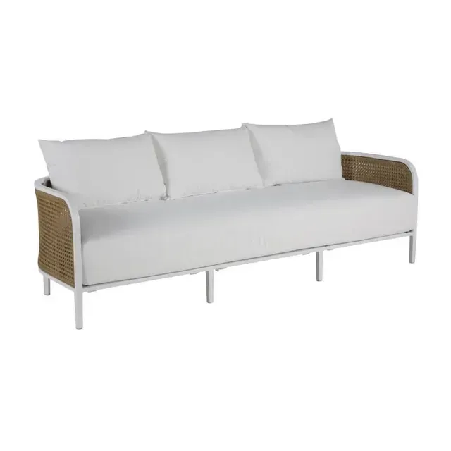 White outdoor sofa with woven wicker armrests and three white cushions.