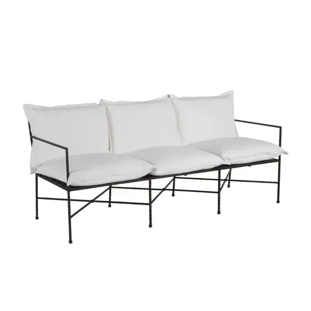 White cushion couch with black metal frame.