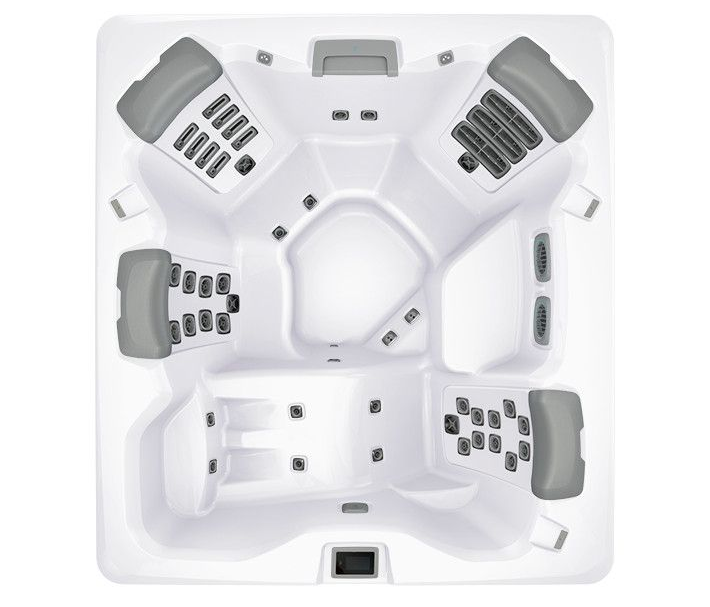 Overhead view of a white hot tub with gray headrests and multiple jet configurations.