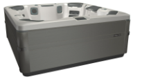 Gray hot tub with light-colored interior, built-in seating, and exterior controls.